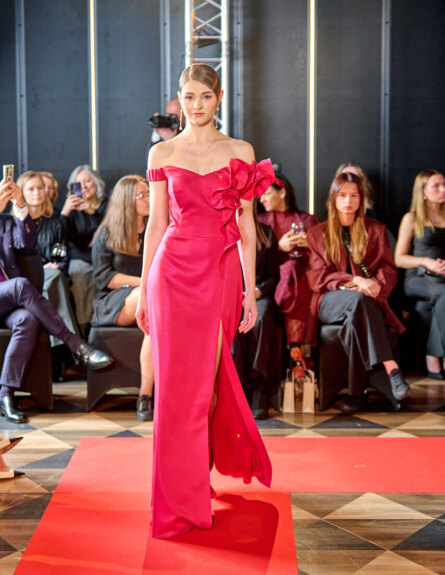 Elegant red gown by Fulara & Żywczyk showcased on the runway
