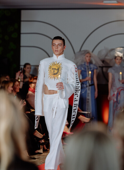 Male model showcasing an alternative design by the brand Asandrov on the runway