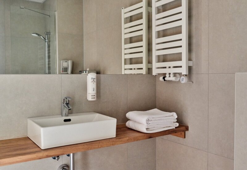 Elegant bathroom at Garni Hotel with modern amenities