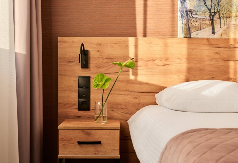 presentation of bed with night table