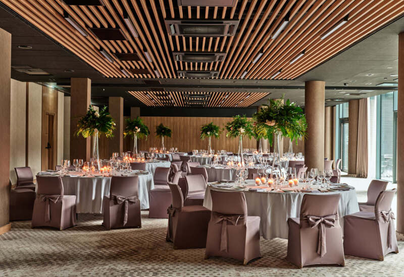 Special event in a modern space – minimalist decorations, stylish tables, and sophisticated interior