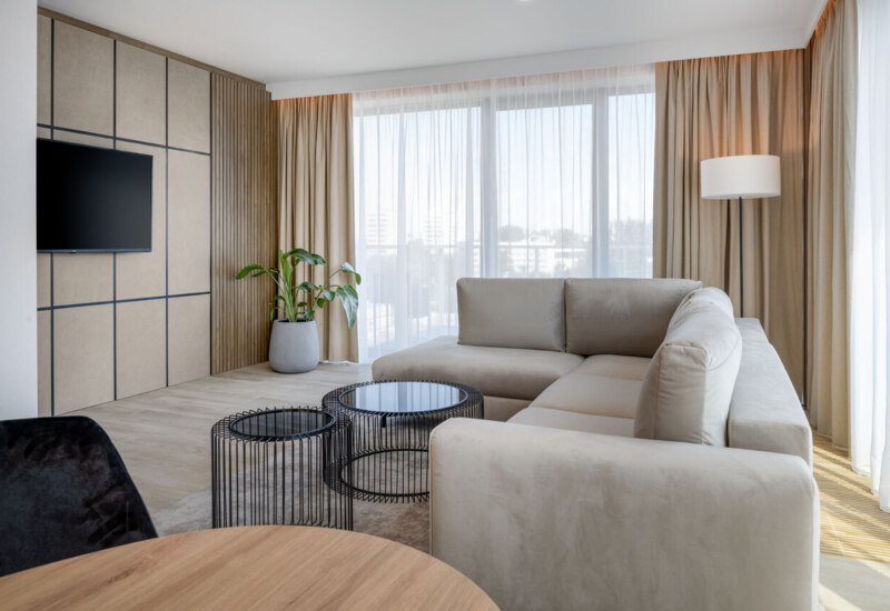 Corner sofa in an apartment in Kraków – a comfortable piece of furniture in the elegant interior of