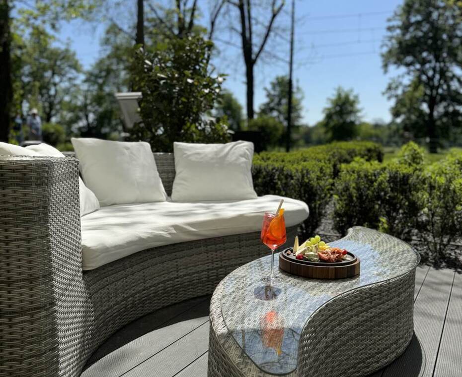 View from the hotel patio with an elegant cheese platter and a drink