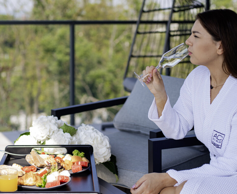 A woman indulging in cheese and wine Spanish-style in Krakow.
