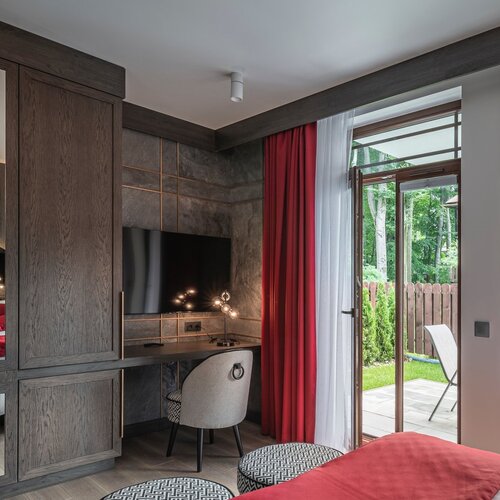 View of the room with a desk and access to the terrace.