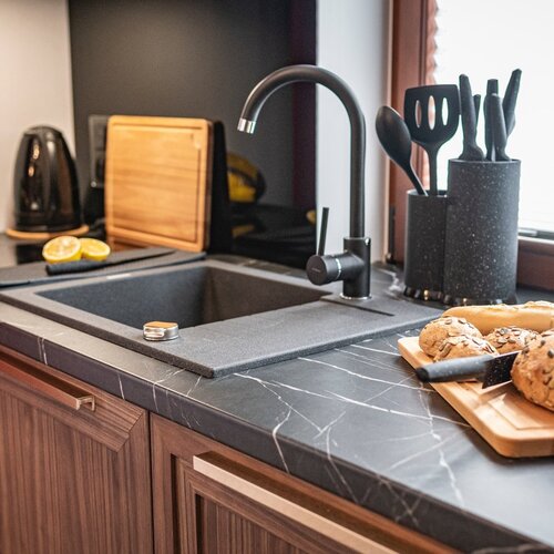 Close-up view of a dark sink.