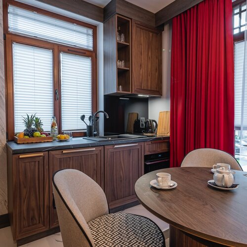 Vie of a kichenette and a round dining table.