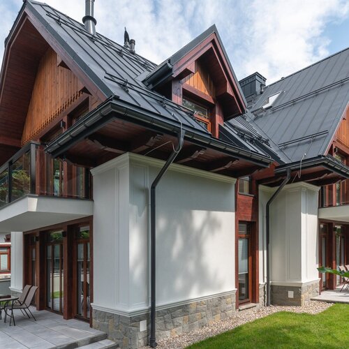 The corner of a modern house in the Zakopane style.