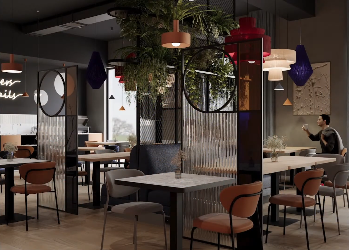 Stylowa hotelowa kawiarnia z marmurowymi stolikami, wygodnymi krzesłami, przegrodami, wiszącą roślinnością, klimatycznymi lampami i gościem z kawą.