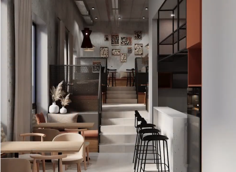 Kawiarnia hotelowa w stylu industrialnym: bar z wysokimi stołkami, przytulne stoliki, podwyższone loże i dekoracje ścienne.