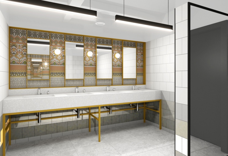 Bright hotel restroom with long white vanity, four sinks, gold-framed mosaic mirrors and modern pendant lights
