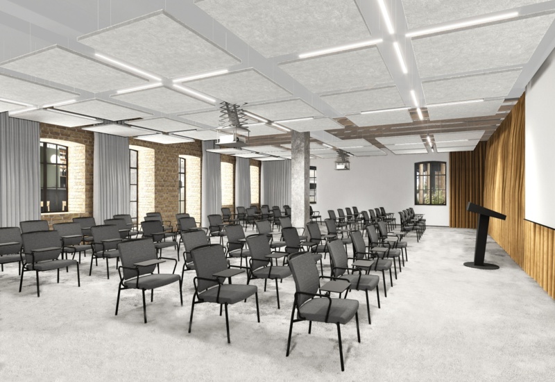 Spacious modern meeting room with rows of armless chairs with tablets, podium, ceiling acoustic panels and exposed brick windows