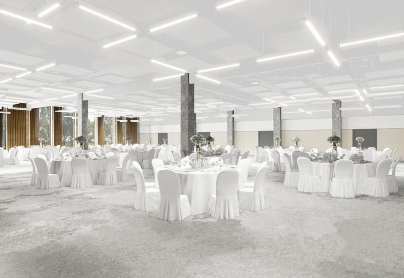 Spacious modern banquet hall with round tables in white linens, floral centerpieces, tall windows, soft carpet and contemporary lighting