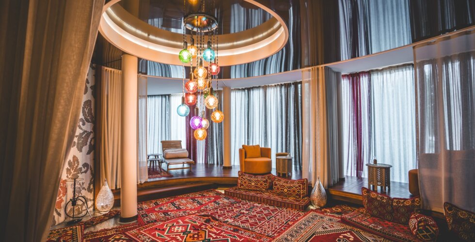 Turkish relaxation zone with soft cushions and mosaic lighting