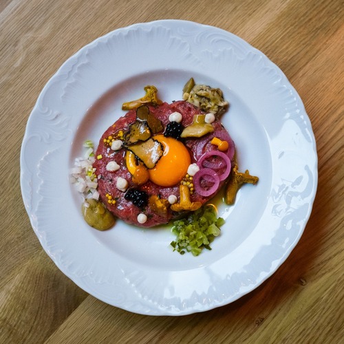 Beef tartare with egg yolk, mushrooms and condiments – Starodworcowa Restaurant