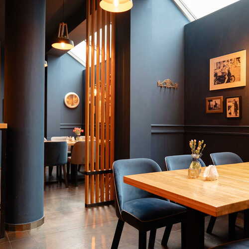 Starodworcowa restaurant Gdynia city center interior with wooden tables and photos