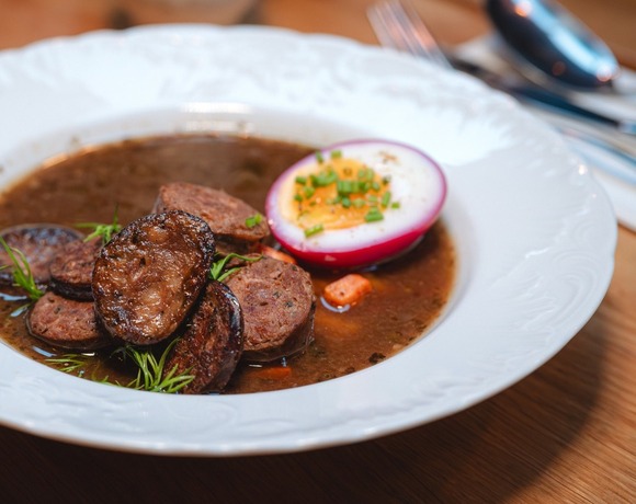 Polish sour rye soup with sausage and egg – traditional dish at Starodworcowa