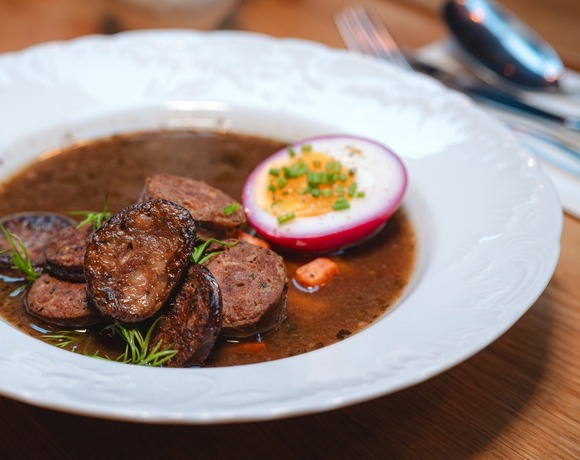 Polish sour rye soup with sausage and egg – traditional dish at Starodworcowa