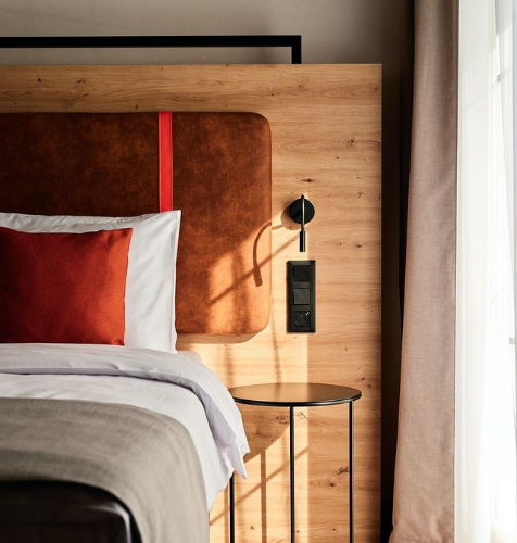 a bed in a room in Hotel Bergo