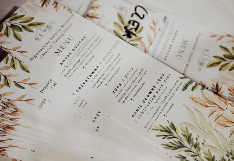 Elegant tasting menu with leaf design, featuring appetizers, soups, and vegetarian main dishes in hotel restaurant