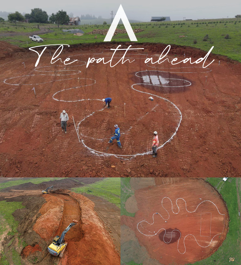 Workers marking winding white-lined paths on red clay construction site while an excavator digs trenches, green fields beyond