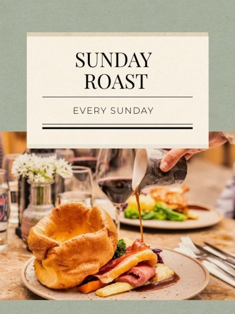 Classic Sunday roast with Yorkshire pudding, sliced roast meat, vegetables, and gravy being poured on a rustic table setting