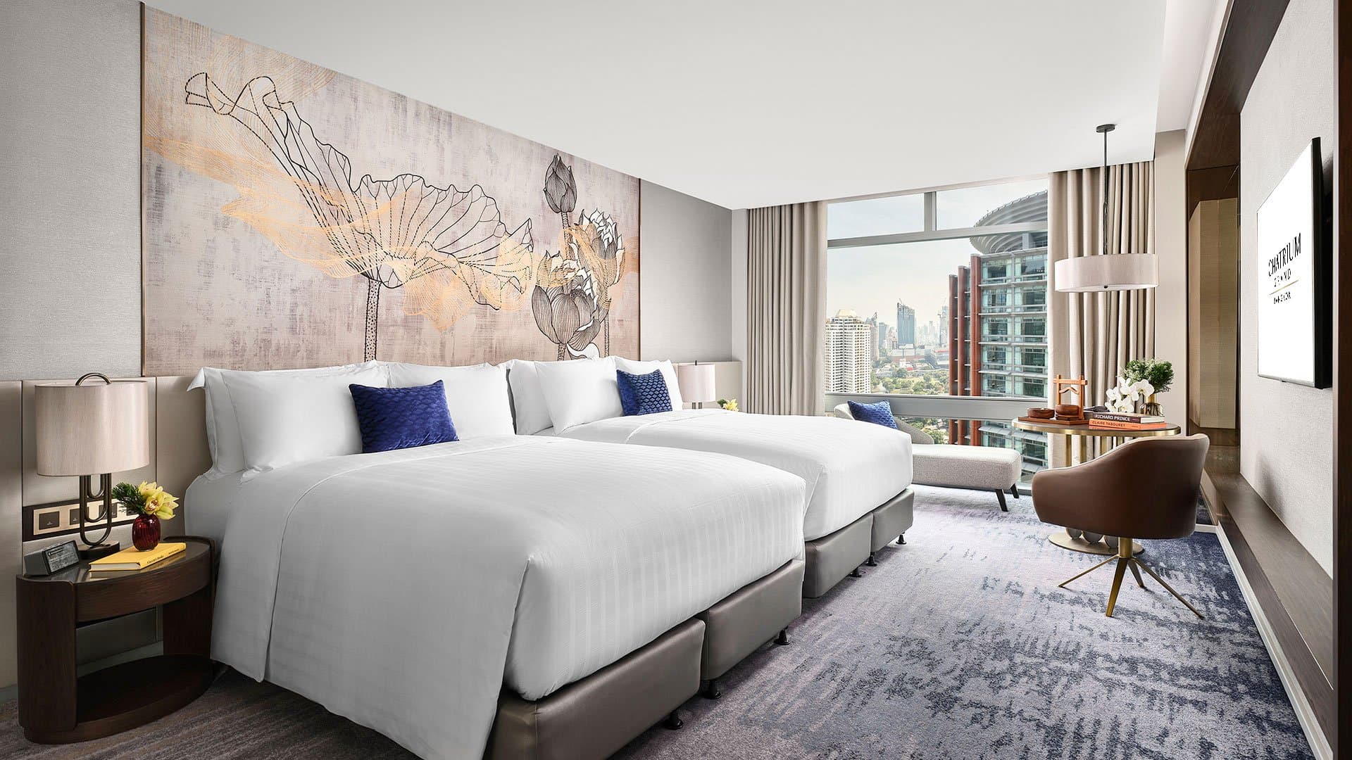  Chatrium Grand Bangkok’s Family Room with two queen beds, ideal for family stays
