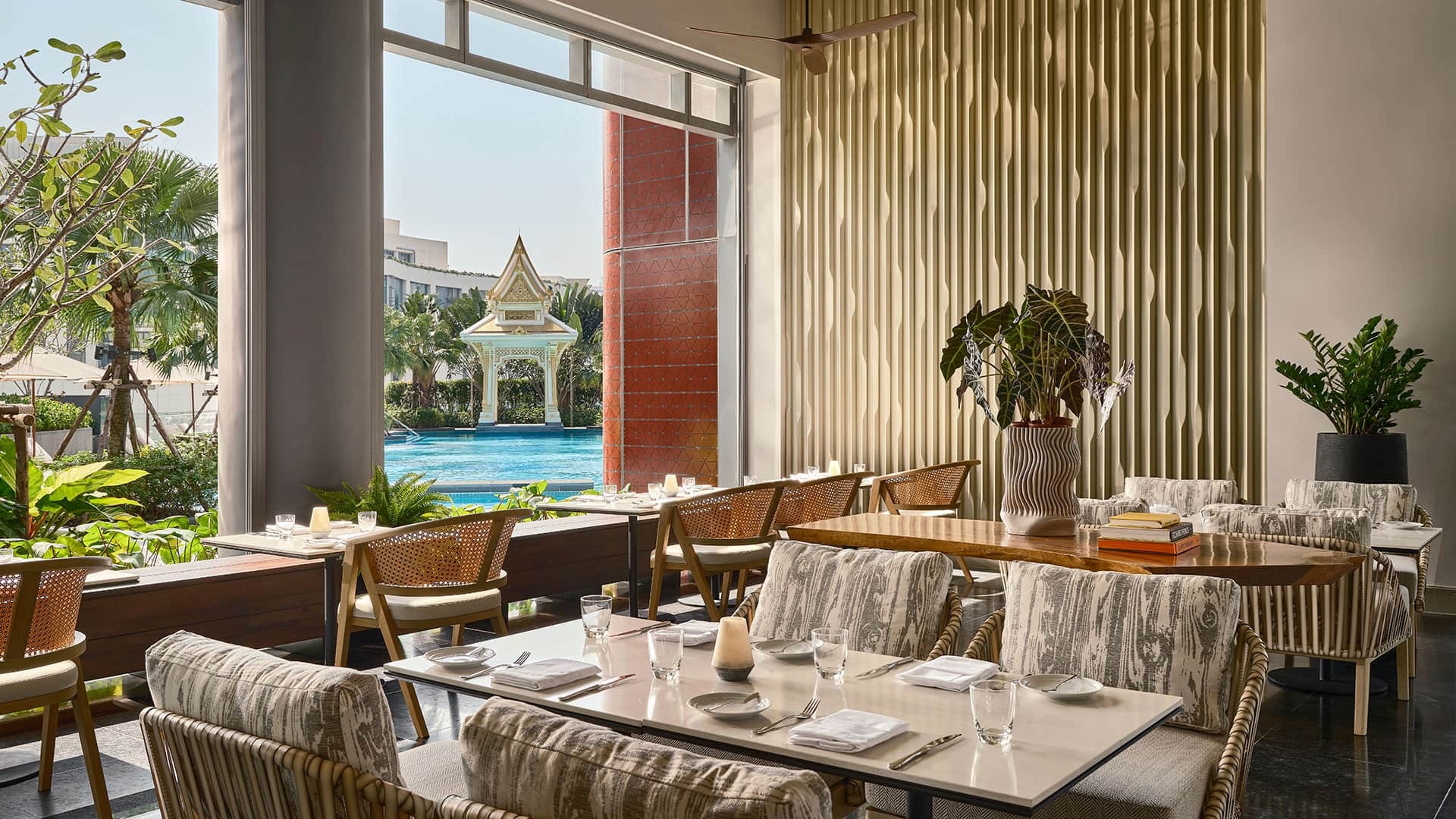 An elegant hotel restaurant at Chatrium Grand Bangkok set for a family dinner.