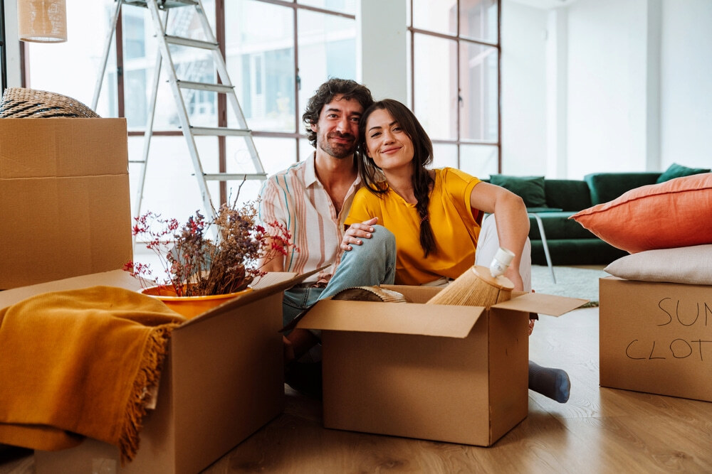 A couple packing for a relocation to Bangkok for work