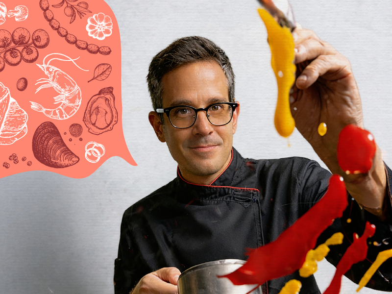 Chef in a black jacket drizzling vibrant yellow and red sauces in a live-kitchen demo, with seafood illustrations suggesting the menu