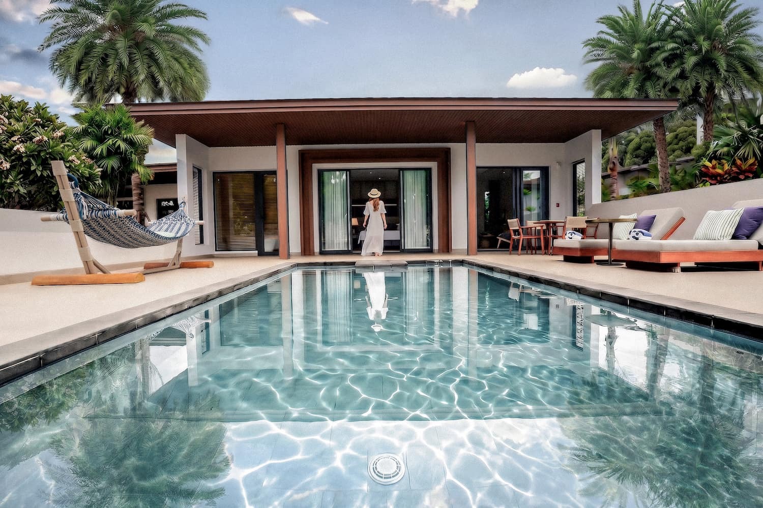 Pool villa with sun loungers at Chatrium Phuket Rawai