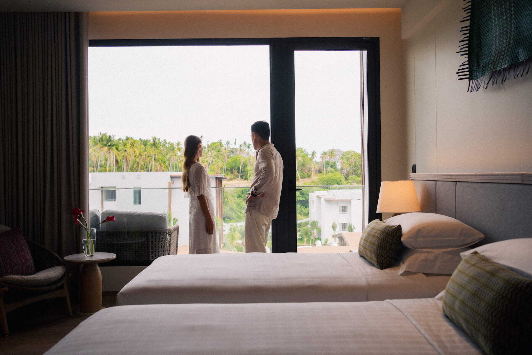 Couple in a suite at Chatrium Phuket Rawai, close to Rawai Pier for island hopping