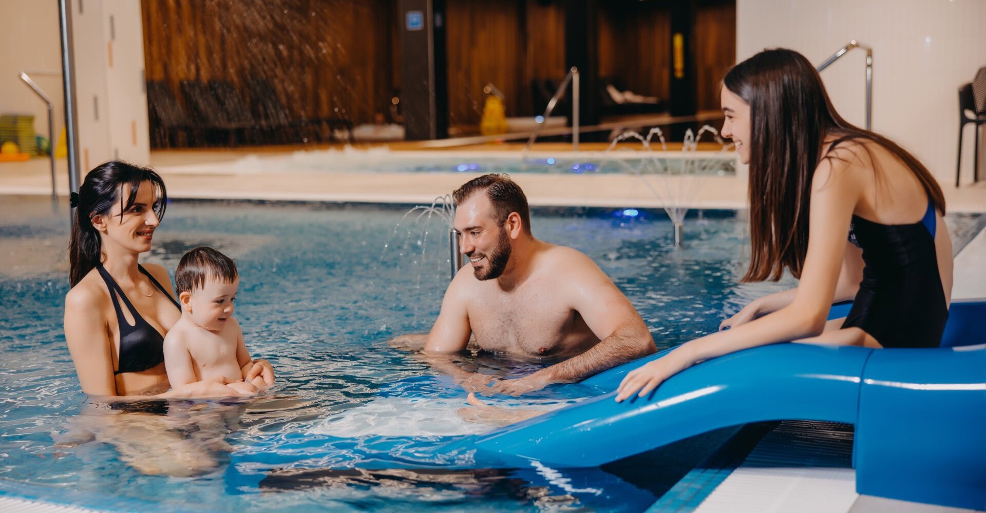 Family with children in the pool