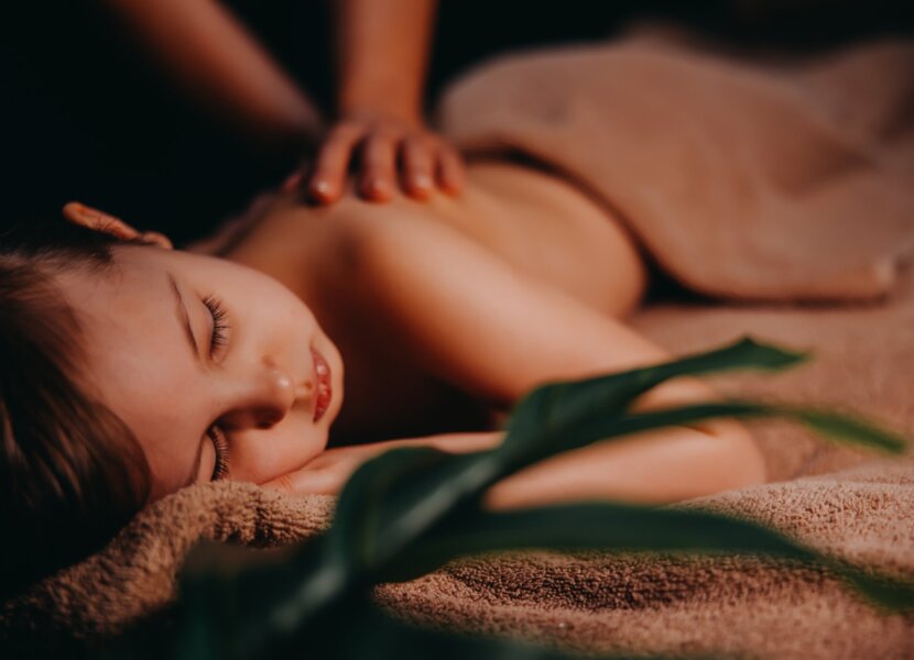 Child having massage at spa