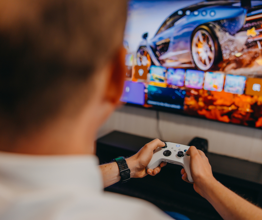 Man playing on game console