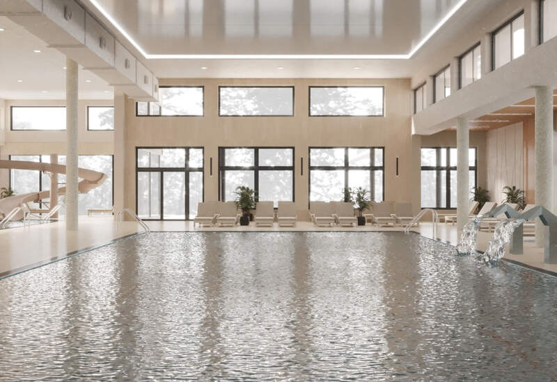Przestronny kryty basen hotelowy z leżakami, dużymi oknami, kaskadami wodnymi, zjeżdżalnią i ciepłym, drewnianym wykończeniem.
