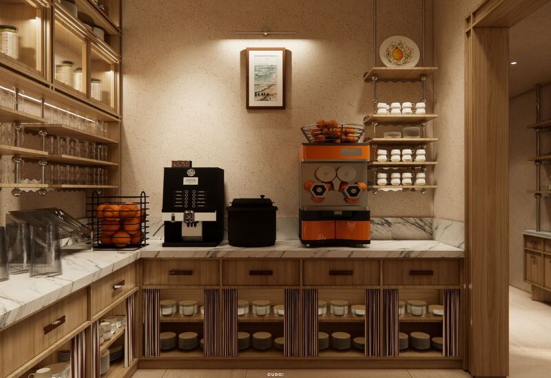 Stacja śniadaniowa z marmurowym blatem, ekspresem, wyciskarką do soku, koszem pomarańczy oraz filiżankami i talerzami na drewnianych półkach