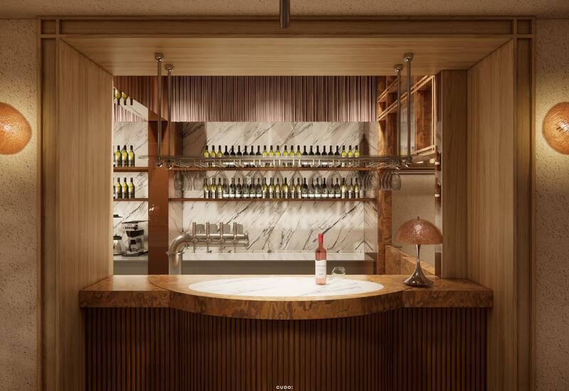 Przytulny bar hotelowy z drewnem i marmurowym blatem, butelką wina i kieliszkiem, wiszącym stojakiem na szkło i kranami do piwa