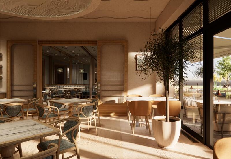 Słoneczne bistro hotelowe z marmurowo-drewnianymi stolikami, krzesłami z rattanu, donicą z oliwką i widokiem na taras.