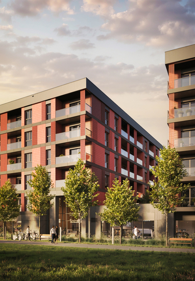 Modern mid-rise hotel with red cladding and glass balconies, tree-lined promenade, ground-floor fitness/café, guests walking and bikes at sunset