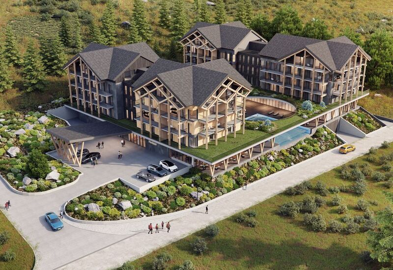 Ośrodek w stylu chalet z drewnianymi budynkami, balkonami, zielonym dachem, basenem zewnętrznym i zadaszonym podjazdem