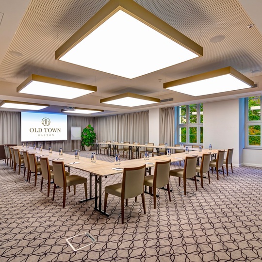 Spacious conference room with modern equipment and large windows