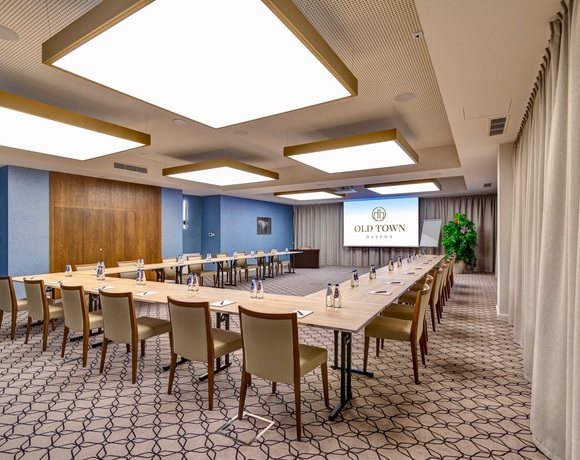 Spacious conference room with modern equipment and projector