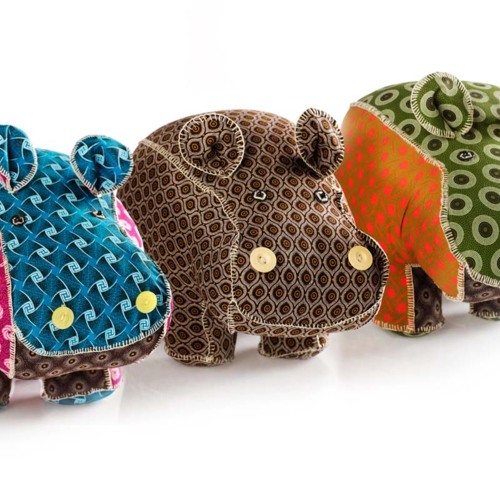 Colorful fabric hippo figurines with intricate patterns and button eyes, adding a playful decorative touch