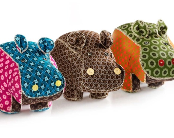 Colorful fabric hippo figurines with intricate patterns and button eyes, adding a playful decorative touch