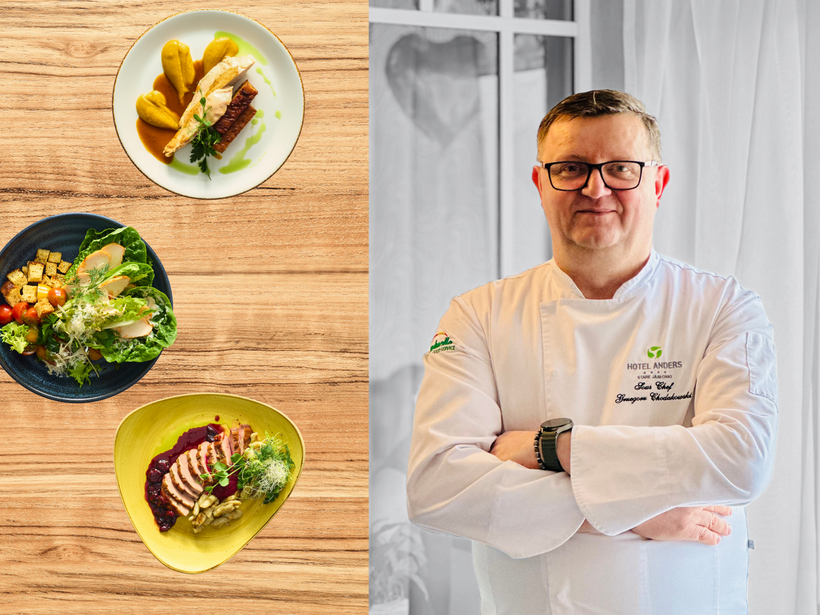 Hotelkoch in weißer Jacke steht am Holztisch neben fünf kunstvoll angerichteten Gerichten des Hotelrestaurants