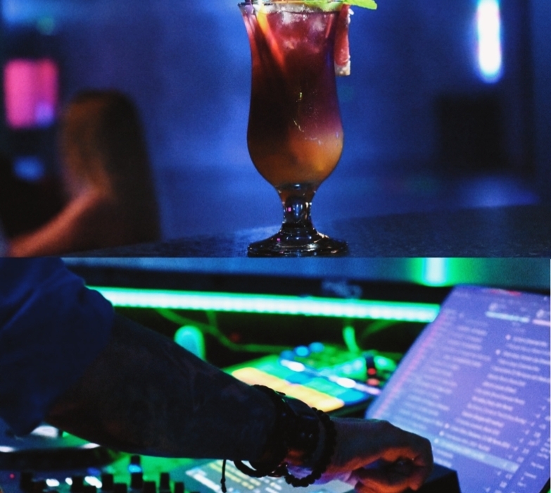 Kolorowy koktajl z miętą w barze z DJ-em i klimatycznym oświetleniem wieczoru