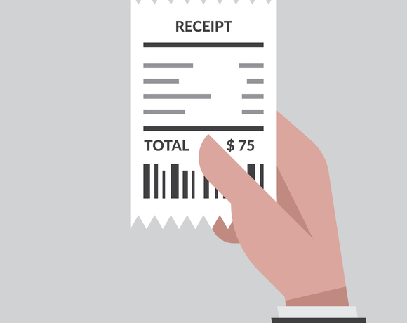 Ręka trzyma paragon z napisem TOTAL i kwotą $75, widoczny kod kreskowy