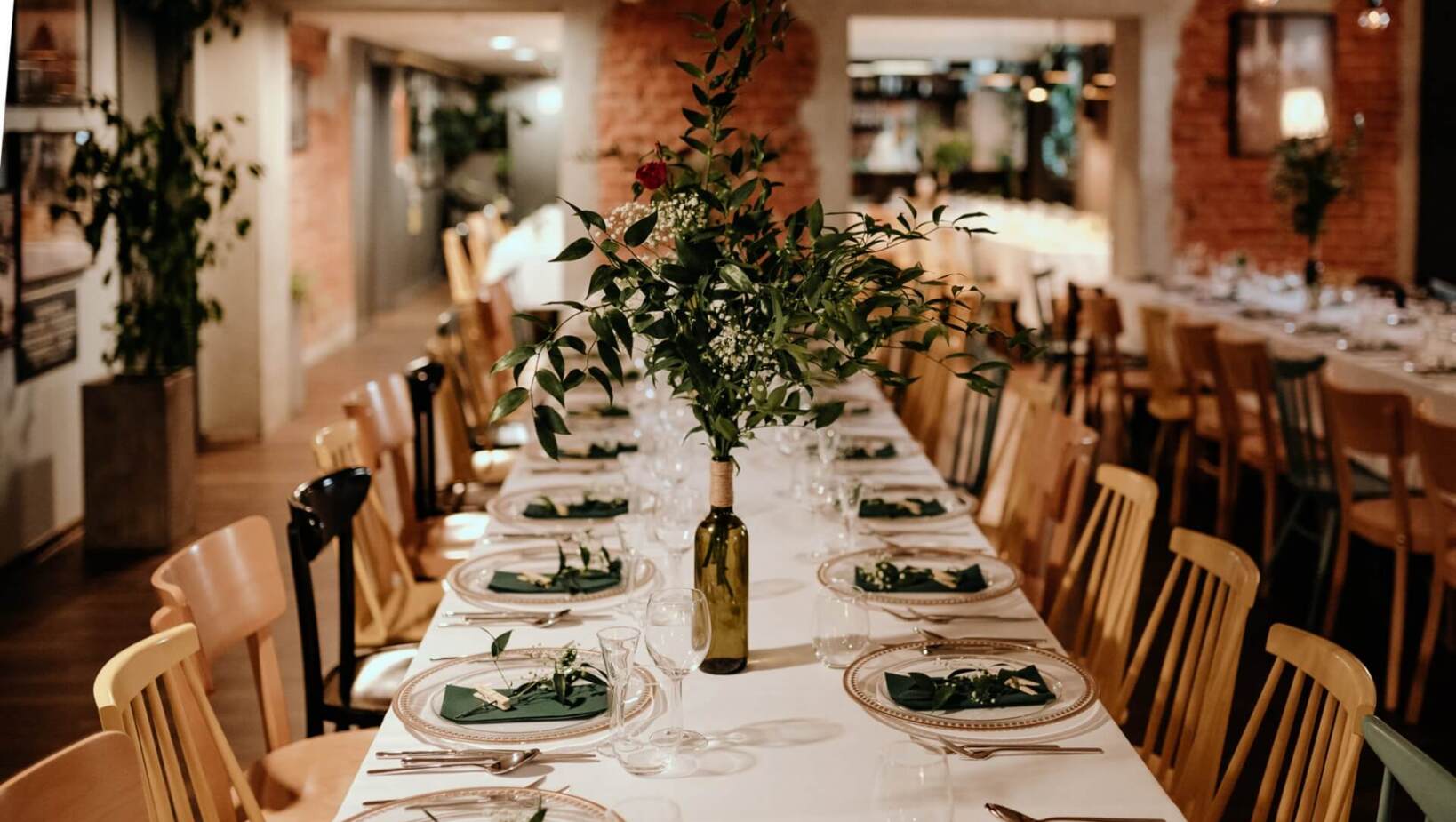 Dining room with rustic decorated table full of tableware and decorations