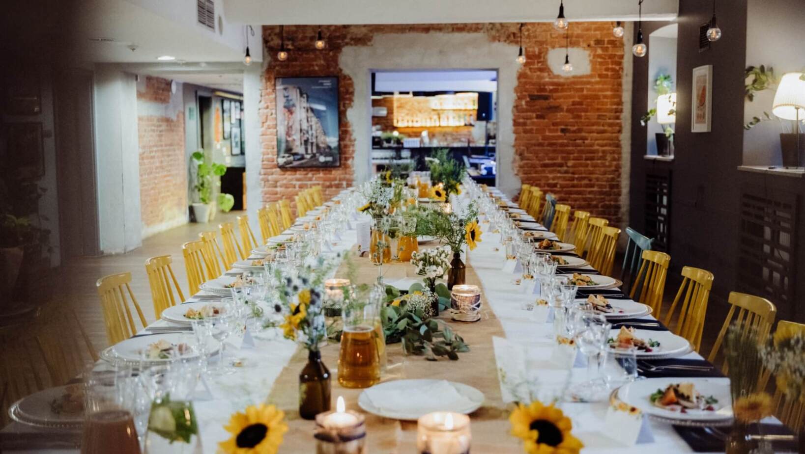 Elegantly set table for a family gathering with sunflowers as the main attraction